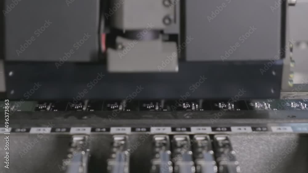 Electronic circuit boards production and installation of SMD components. Automatic equipment places chips and processors. Manufacture of electronic chips. High-tech. Robotic concept. Slow motion. Electronic circuit boards production and installation of SMD components. Automatic equipment places chips and processors. Manufacture of electronic chips. High-tech. Robotic concept. Slow motion.