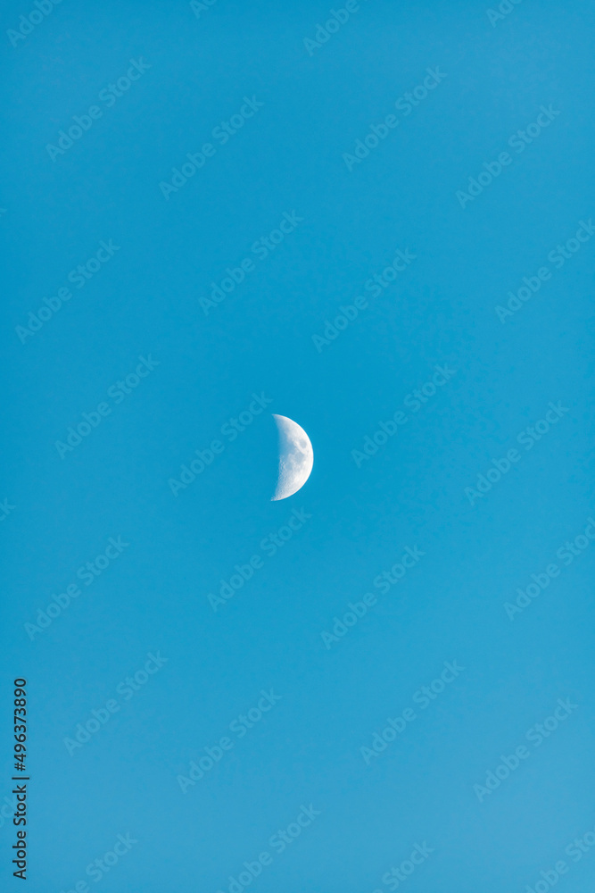 Young moon rising in the evening skies Young moon rising in the evening skies
