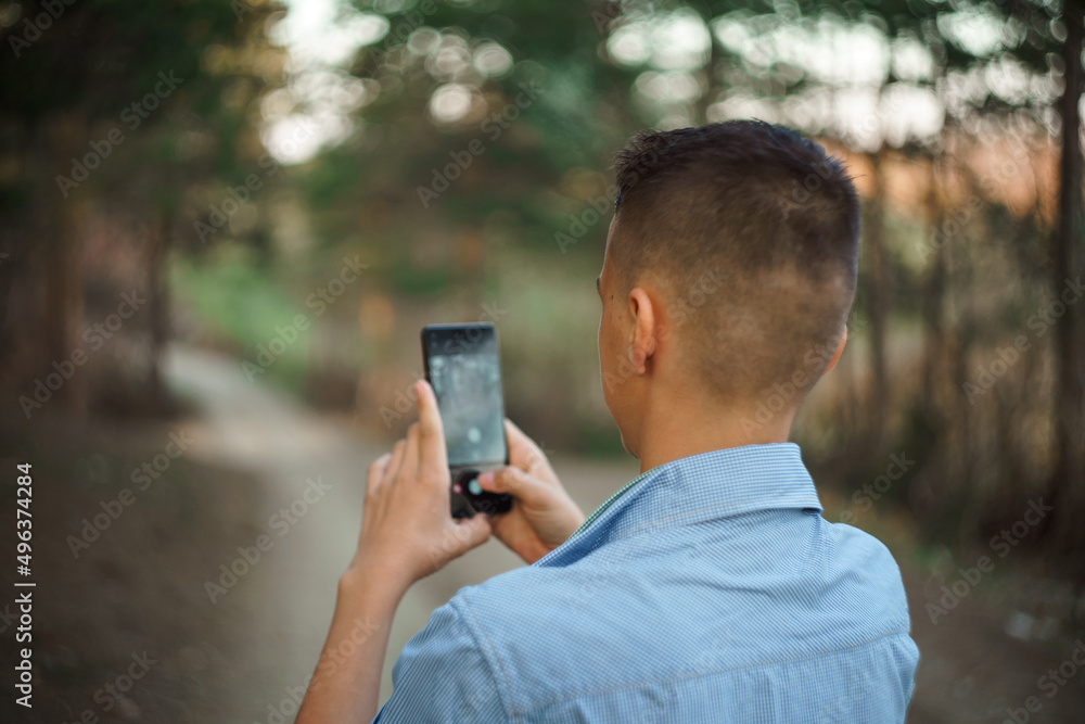 photo boy with a mobile phone in various poses, the concept of modern life photo boy with a mobile phone in various poses, the concept of modern life