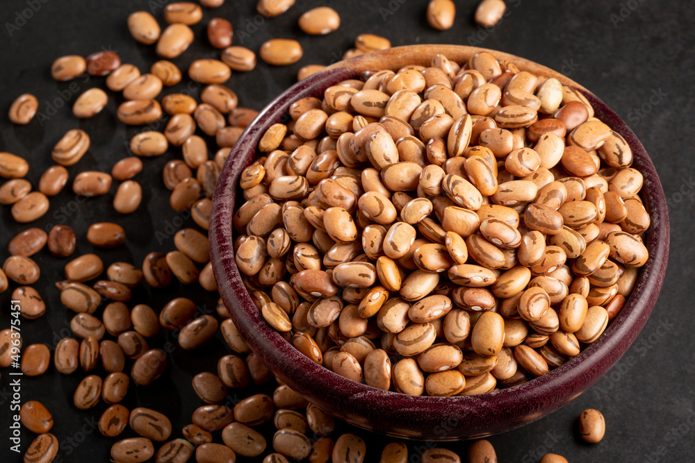 Raw pinto beans on the table. Raw pinto beans on the table.