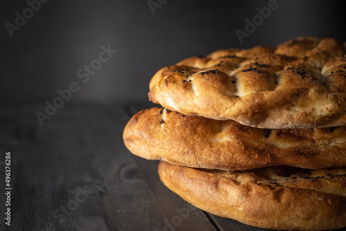 Ramadan Pita (Ramazan Pidesi). Traditional Turkish bread for holy month Ramadan. Side view and copy space. photo
