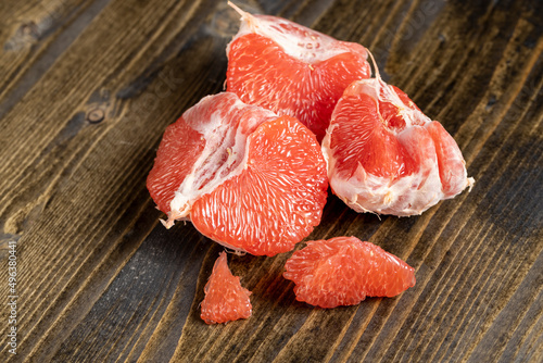 red ripe grapefruit on a cutting board