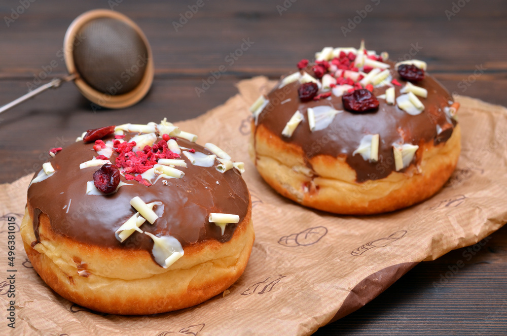 freshly baked donuts on parchment paper close-up freshly baked donuts on parchment paper close-up