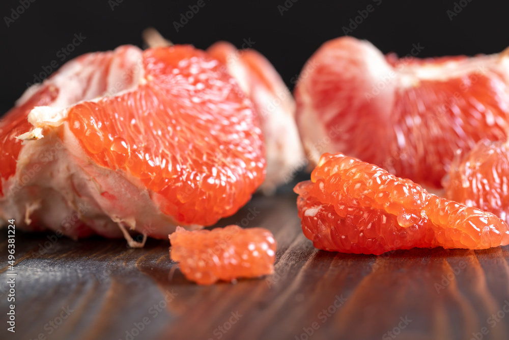 red ripe grapefruit on a cutting board red ripe grapefruit on a cutting board