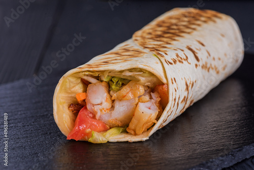 Shrimp doner on a black slate tray