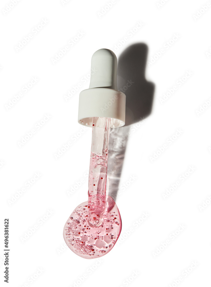 Nail and cuticle serum scrub with dropper isolated on white background. Beauty and health care concept Nail and cuticle serum scrub with dropper isolated on white background. Beauty and health care concept