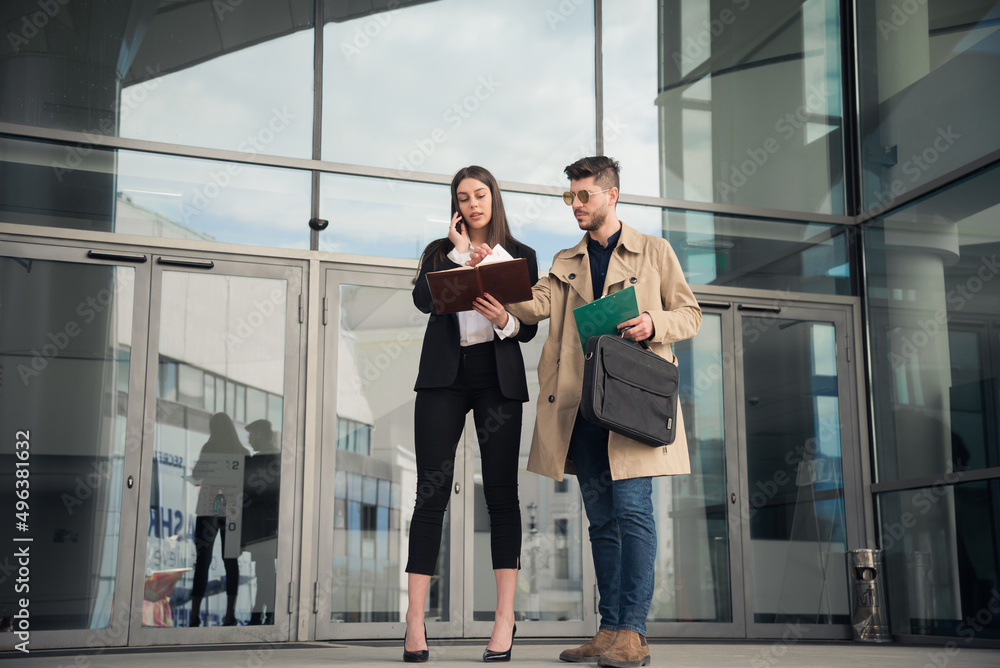 Female boss and her assistent in front of the company