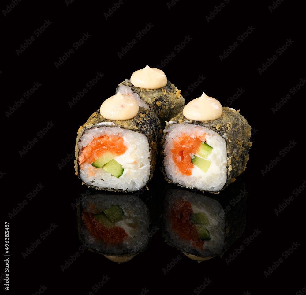 rolls on a black background with reflection rolls on a black background with reflection