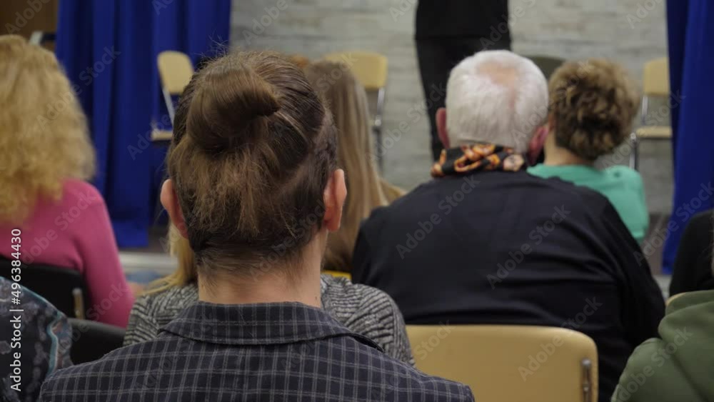 Corporate business event, seminar of business start up. Back view of unrecognizable people at a conference or presentation, workshop, master class Corporate business event, seminar of business start up. Back view of unrecognizable people at a conference or presentation, workshop, master class
