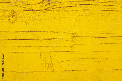 Pintura amarilla sobre madera antigua photo