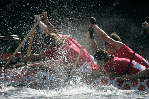 people racing a dragon boat