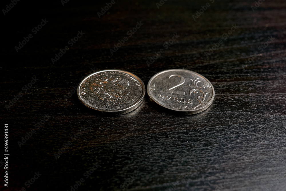 Coin of two rubles on a black table Coin of two rubles on a black table