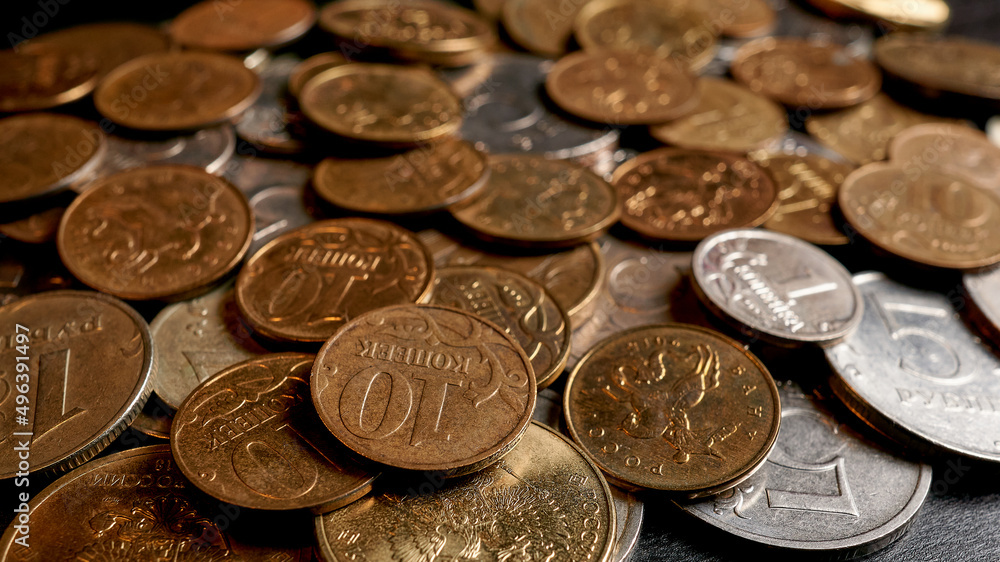 A scattering of Russian coins of rubles and kopecks A scattering of Russian coins of rubles and kopecks