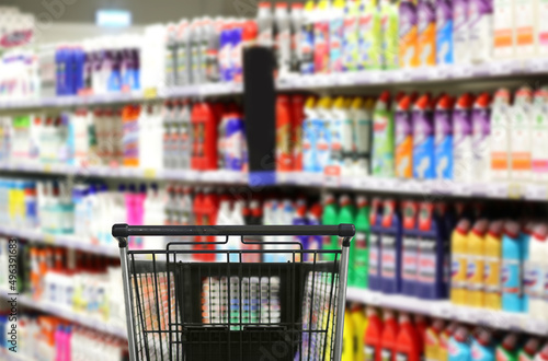 Photos choosing detergents, toilet paper in supermarket