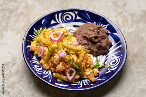 Scrambled eggs with green beans. Mexican food photo