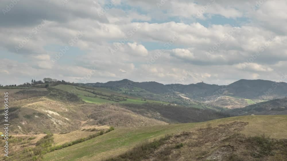 Time lapse on the gentle hills of Bologna with clouds moving and light dancing on the hills, Emilia Romagna, Italy Time lapse on the gentle hills of Bologna with clouds moving and light dancing on the hills, Emilia Romagna, Italy