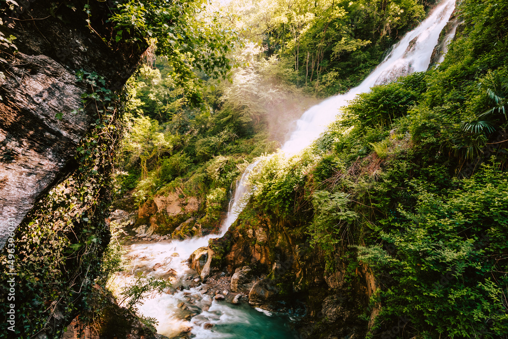 Waterfall immersed in the vegetation of the Orrido of Bellano, long exposure Waterfall immersed in the vegetation of the Orrido of Bellano, long exposure