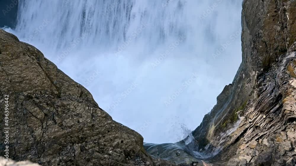 Raging waterfall surrounded by rocks. Includes the sound of the falling water.
Raging waterfall surrounded by rocks. Includes the sound of the falling water.