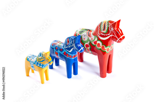 Swedish traditional souvenir Dala or Dalecarlian horses, different colors and sizes, isolated photo