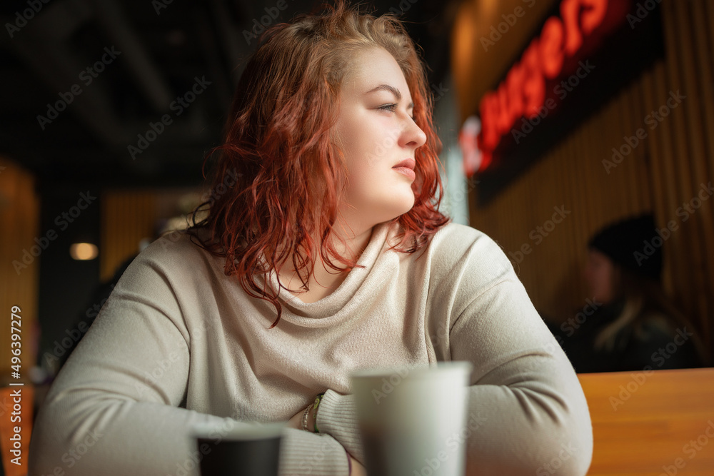 Portrait of a beautiful young red-haired plump girl close-up. Portrait of a beautiful young red-haired plump girl close-up.