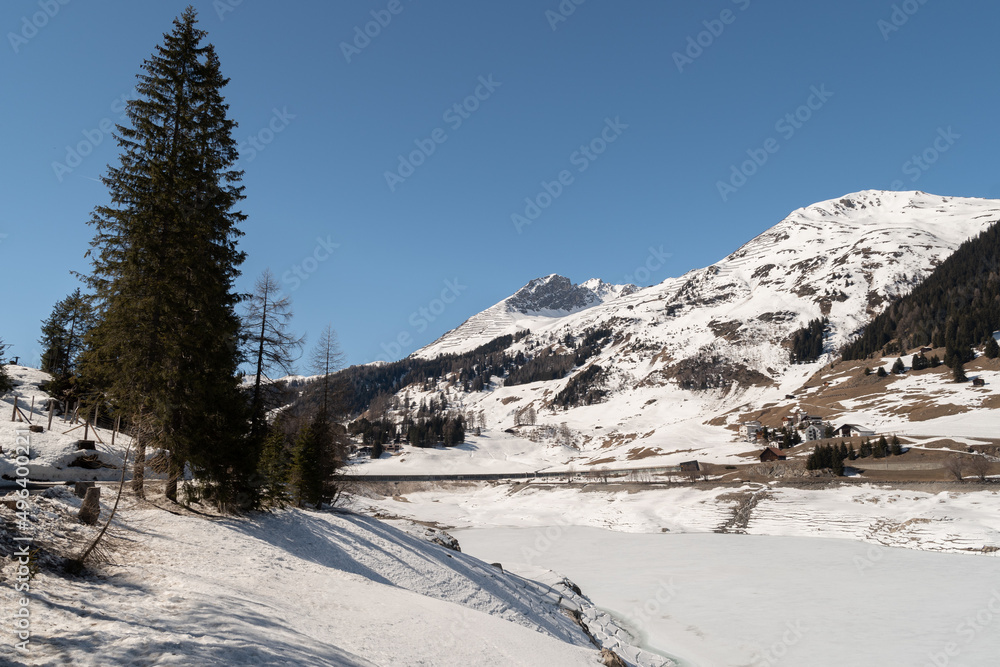 Frozen lake of Davos on a sunny winter day in Switzerland Frozen lake of Davos on a sunny winter day in Switzerland