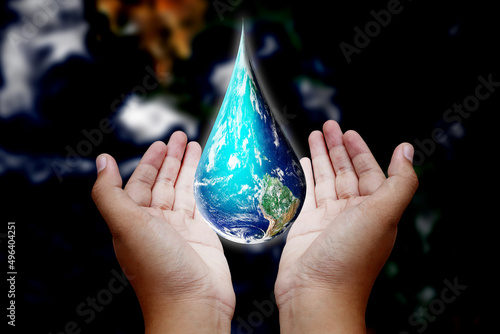 earth in drop shape from on two hands, Elements of this image furnished by NASA
