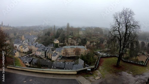 PAN SLOW MOTION - The Grund district is one of Luxembourg City's oldest neighborhoods, located on the banks of River Alzette. Neimenster Cultural Center and St John's Church. photo