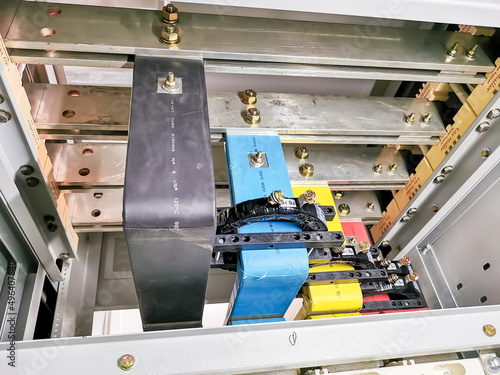 Image of copper busbar connection in electrical cabinet. Selective focus.