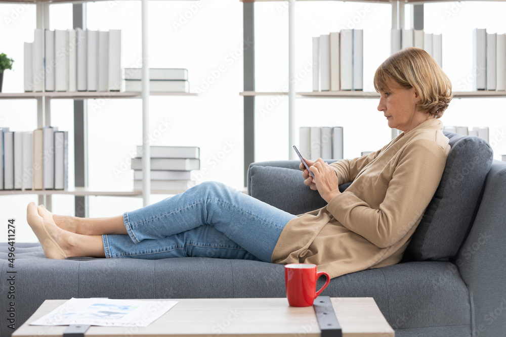 senior woman using smartphone for work in free time senior woman using smartphone for work in free time
