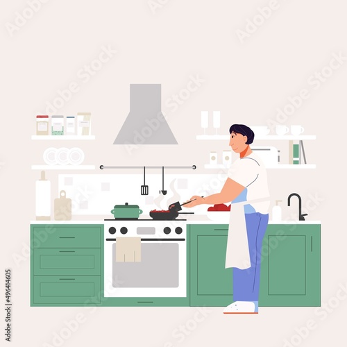 The man is cooking in the kitchen. Apron for cooking. Cozy kitchen with appliances and utensils.