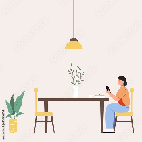 A woman sits at a table, holding a phone in her hands. Lonely. Cozy dining room.