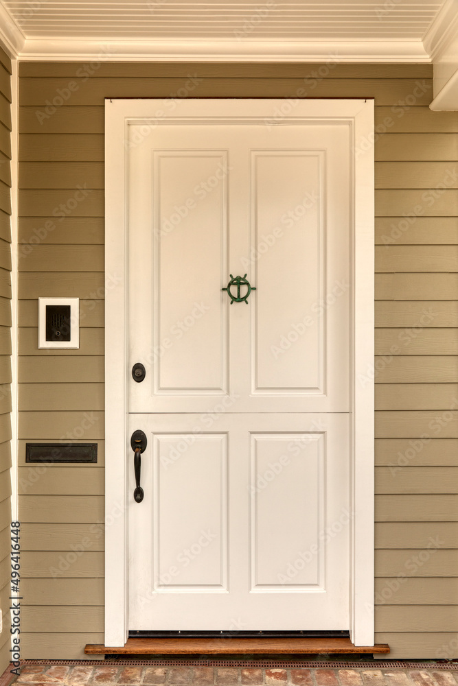 Fototapeta premium Front door, white front door with a door knocker.