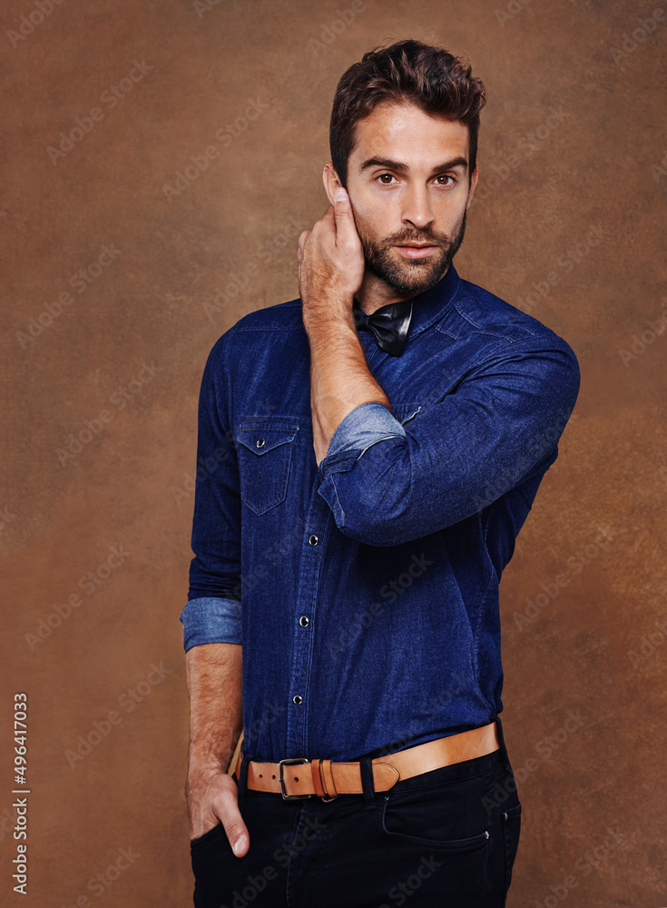 Rugged good looks and style. Studio shot of a stylishly dressed young man. Rugged good looks and style. Studio shot of a stylishly dressed young man.