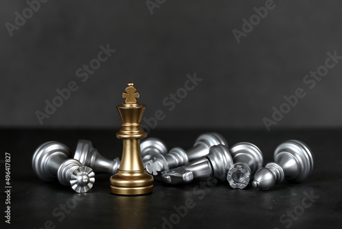Close-up king chess standing on falling chess concepts of wining to challenge or battle fighting of business team and leadership strategy and organization risk management or team player.