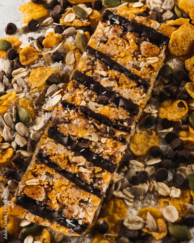 chocolate cereal bar above corn flakes, almonds, sunflower seeds, chocolate chips, pumpkin seeds