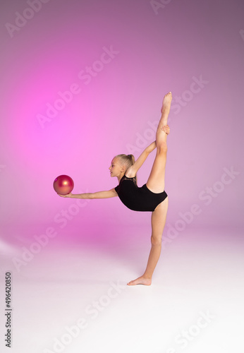 rhythmic gymnastics, girl gymnast and ball, pink color

 photo