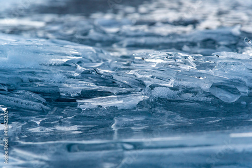 Stunning ice formations on the side of a frozen lake. 