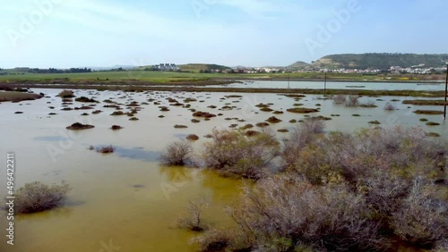 Swamp lake Oroklini in Larnaca in Cyprus. Habitat for 30 bird species. Drone aerial video. photo