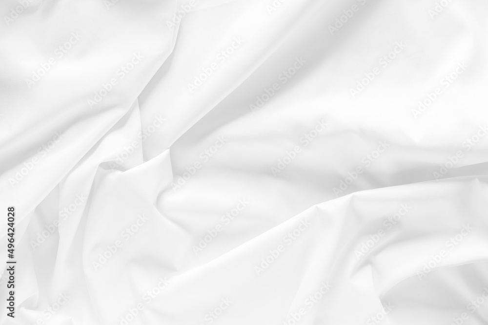 White fabric texture background. Cloth soft wave. Creases of satin, silk, and cotton.