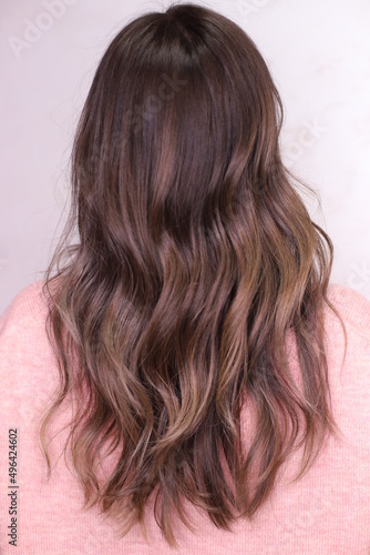 modern hairstyle. the brunette. the hair was dyed in the ombre technique.