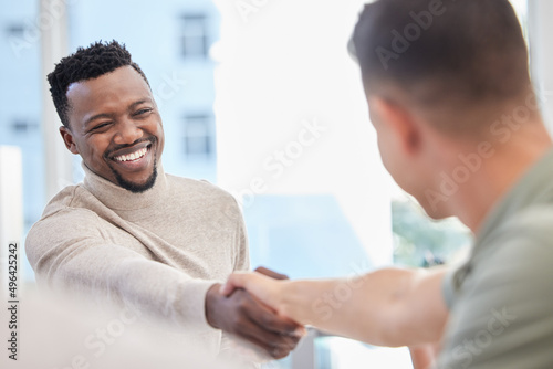 Im excited to get started on this project with you. Shot of two businessmen shaking hands during a meeting in an office. © Irshaad Majal/peopleimages.com