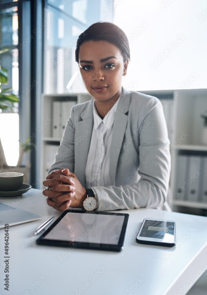 Success is a consistent daily effort. Portrait of an attractive young businesswoman working inside her office. Success is a consistent daily effort. Portrait of an attractive young businesswoman working inside her office.