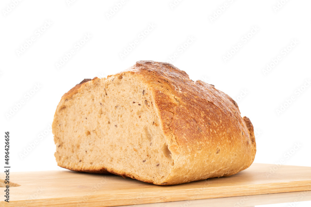 One half of buckwheat fragrant bread, macro, isolated on a white background.