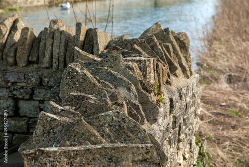 Top of dry stone contry house garden wall closeup photo