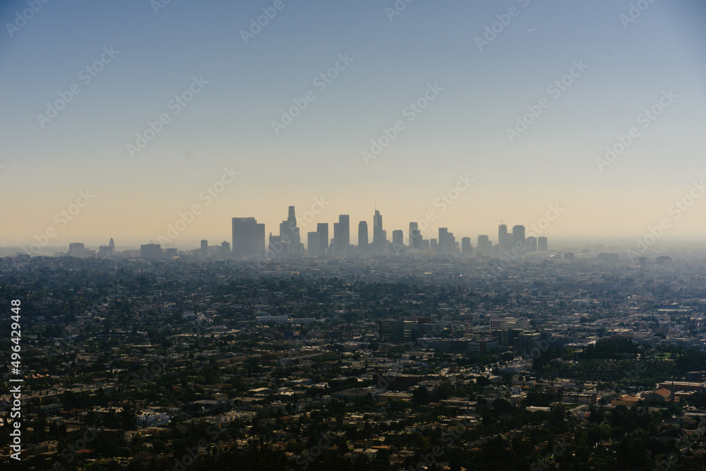 Los Angeles city skyline silhouette in fog. Construction business concept.