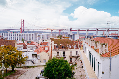 Roof top view on suspension 25 April bridge bridge over the Tagus river in Lisbon, Portugal.