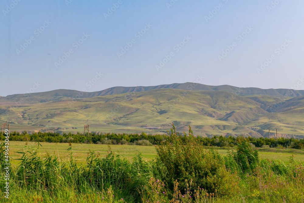 mountainous terrain and green fields in georgia