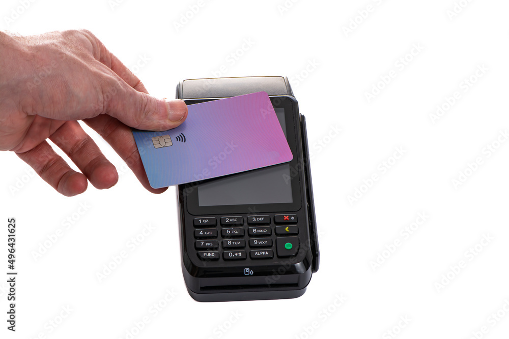 Attached plastic card to the payment terminal with a man's hand on a white isolated background Attached plastic card to the payment terminal with a man's hand on a white isolated background