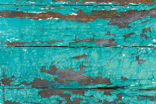  Background of old brown wood texture with blue cracked paint, closeup image