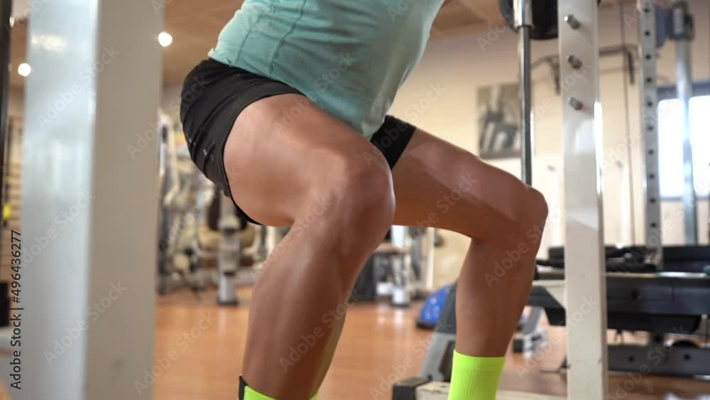 A caucasian man in the gym lifting weights with a lot of effort, healthy and healthy life doing sports A caucasian man in the gym lifting weights with a lot of effort, healthy and healthy life doing sports